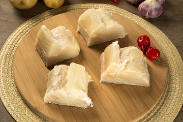 salted codfish on the wooden table with ingredients