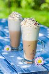 Cold coffee in sunny garden