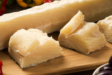 salted codfish on the wooden table with ingredients