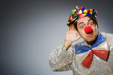 Funny clown against dark background