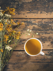 Dried herbs and tea on wooden background   © yossarian6