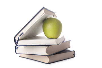 green apple and books isolated