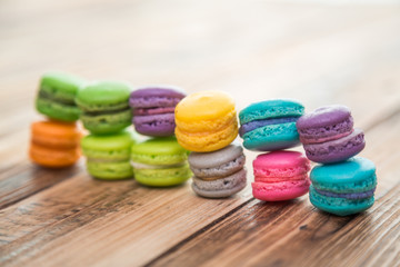 French colorful macarons on wood table