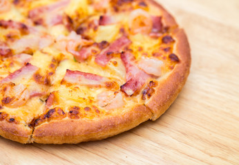 Pizza on wooden background