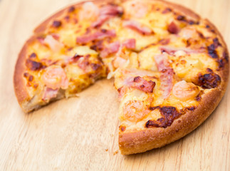 Pizza on wooden background