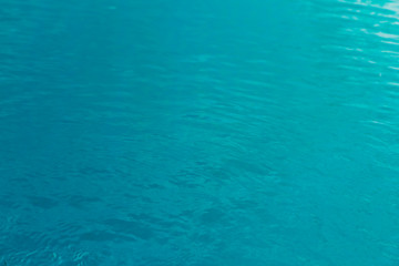 Blue swimming pool rippled water