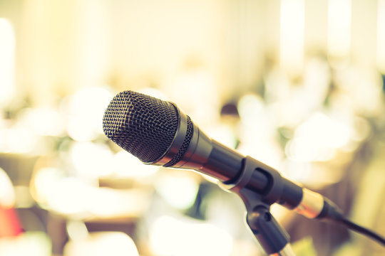 Black microphone in   conference room ( Filtered image processed