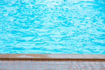 Blue swimming pool rippled water