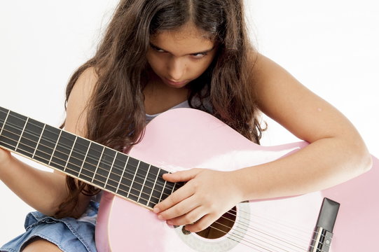 Girl playing guitar and sing
