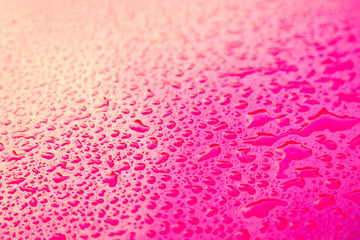 Drops of water on red  floor