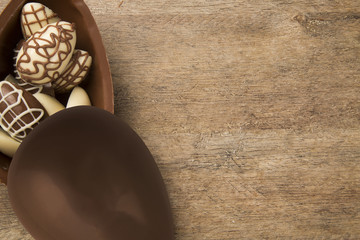 Fototapeta premium Chocolate Easter Eggs Over Wooden Background