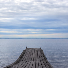 Fototapeta na wymiar Old pier on nice lake
