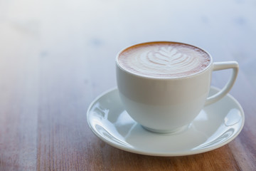 Latte Coffee art on the wooden table