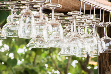 Wine glasses on the bar on a dark background