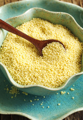 Couscous grains in bowl. Top view