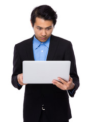 Young businessman use of the laptop computer