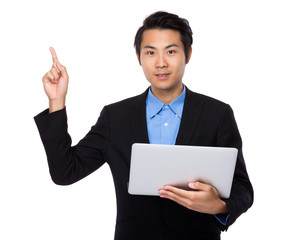Asian businessman use of the notebook computer and finger point