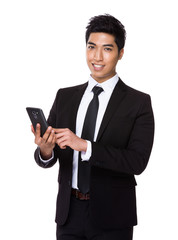 Asian businessman use of the cellphone