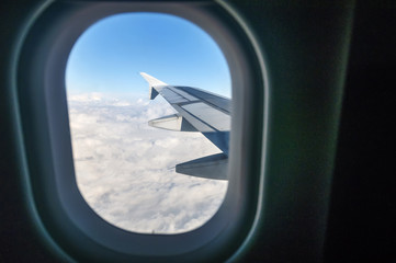 Fototapeta na wymiar Looking out the window of a plane