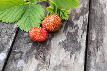 fresh strawberry on the old wooden board