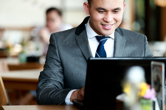 businessman surfing the internet on his laptop
