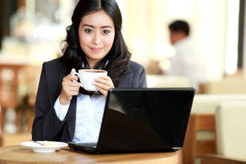 businesswoman having coffee break