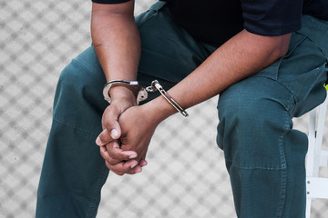  the man was bound by hand in the handcuffed out of freedom