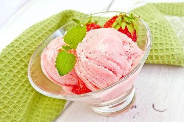 Ice cream strawberry in glass on board