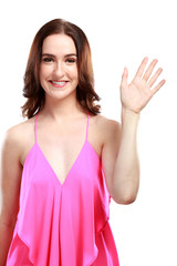 woman smiling while waving hand