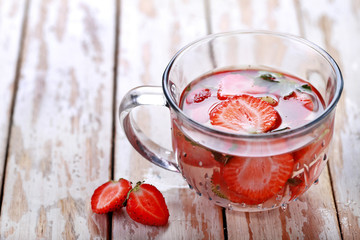 a glass of strawberry infused water