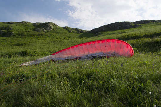 Parachute lying on mountain slope