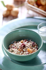a bowl of muesli with berry and raisin