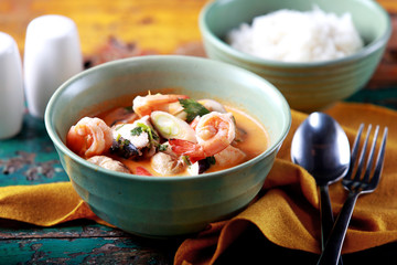 a bowl of thai tom yam soup
