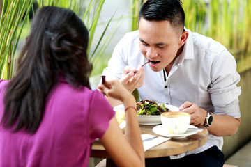 young couple having lunch together