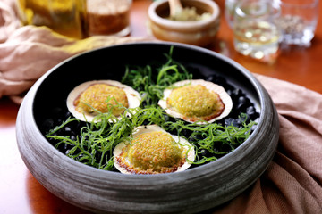 spanish cuisine baked scallops served as tapas