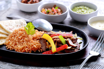 mexican beef fajitas with flour tortillas and rice