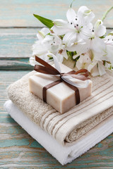 Fototapeta na wymiar Bar of handmade natural soap lying on the towels