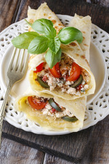 Mediterranean cuisine: crepes stuffed with cheese and vegetables