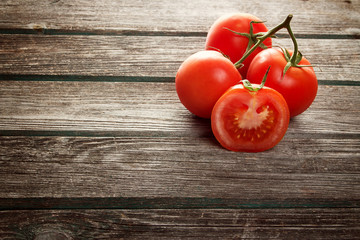 Red potatoes on wooden background