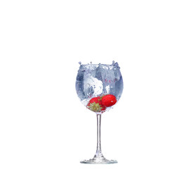 Strawberry splash in a cocktail glass on white