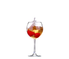 Single Strawberry splashing into a glass of wine