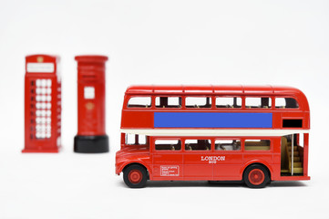 Postbox and red telephone box with red bus
