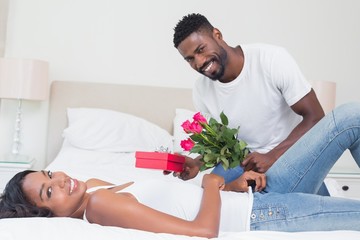 Romantic man giving roses to partner