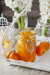Peach jam in glass jar