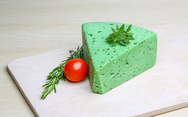 Green pesto cheese and basil leaves