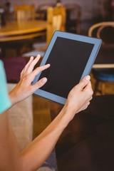 A woman using tablet computer 