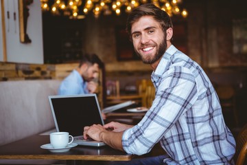 young man working on his computer