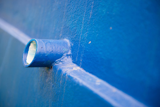 drain pipe on blue wall at home