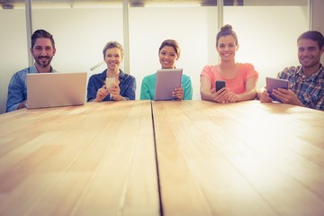 Fototapeta premium Creative colleagues with laptop and digital tablet