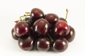Handful of dark red sweet cherry